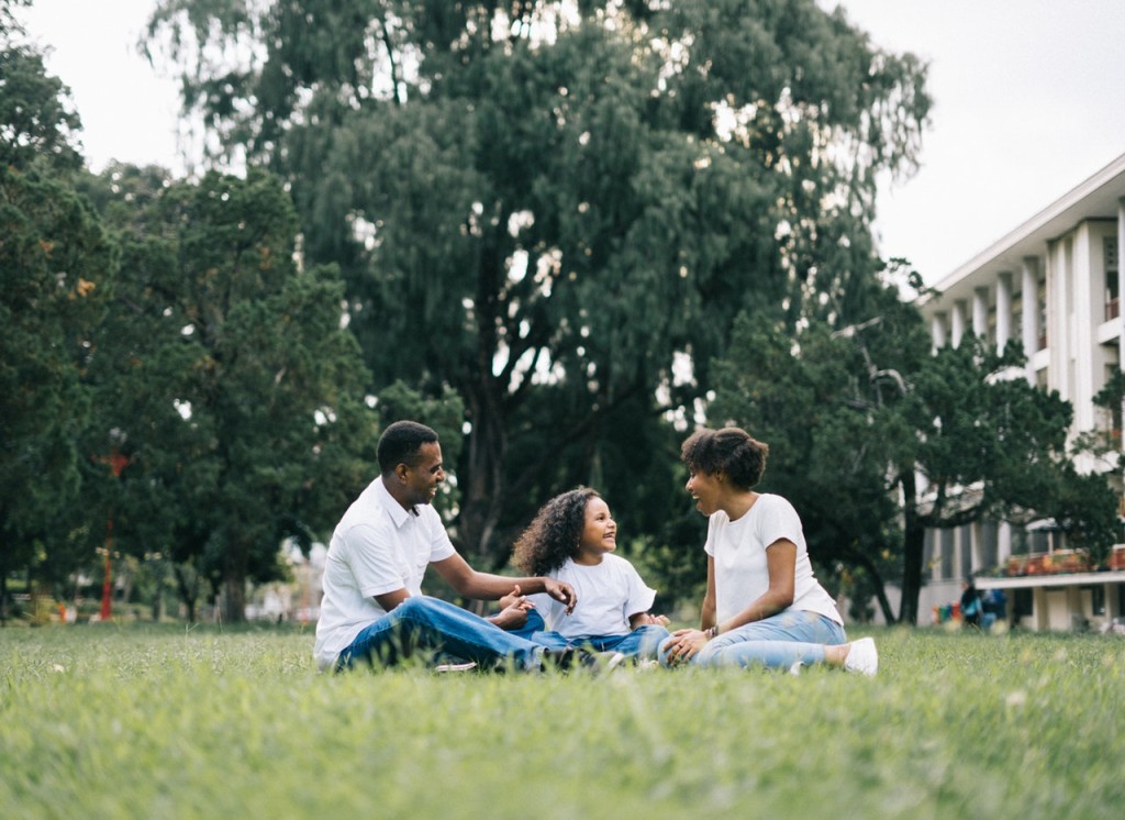 child with family in daylight