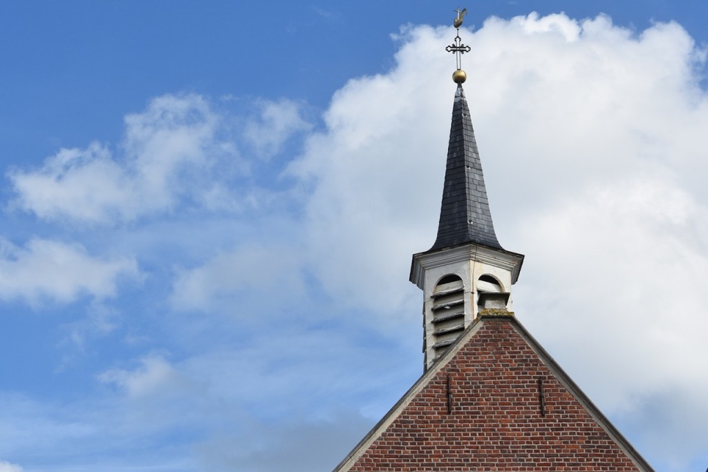 church roof top against blue sky background